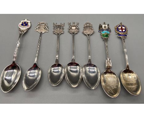 A Lot of seven Birmingham Silver souvenir tea spoons. Some designed with enamel tops. 