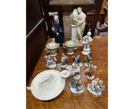 A Selection of collectable porcelain wares to include Pearl ware lady at a memorial statue, Parian Griffin topped candle hold