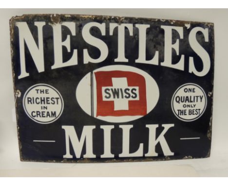 A single sided enamel metal advertising sign "Nestles Milk", white lettering on blue ground, 38.5cms x 53.5cms