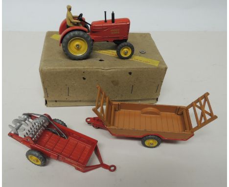 DINKY - 27A Massey-Harris Tractor with adjustable front wheels, in box; a Massey-Harris Manure Spreader and a Halesowen Farm 