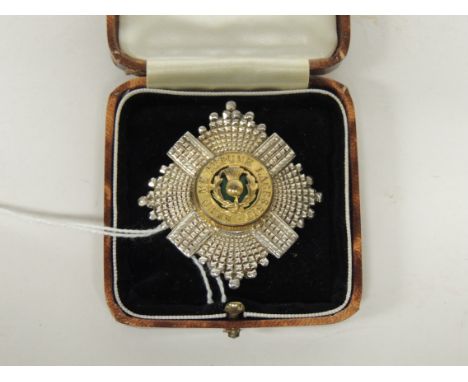 A Scots Guards sterling silver badge with green enamel and gilt metal centre, now fitted with brooch pin, stamped on the back