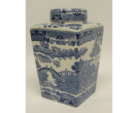 A glazed pottery tea caddy and cover for "Thomas & Evans Celebrated Tevna Tea" the caddy of tapering square form with Willow 