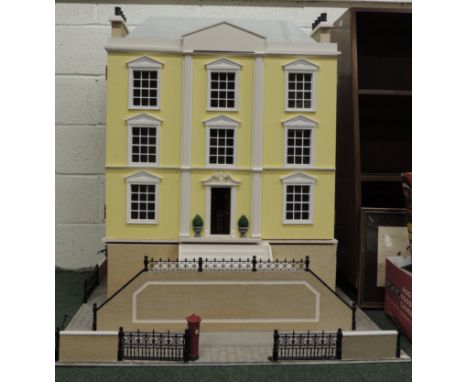 A large modern Georgian style dolls town house on base board and with road frontage, steps to the front door, the front openi