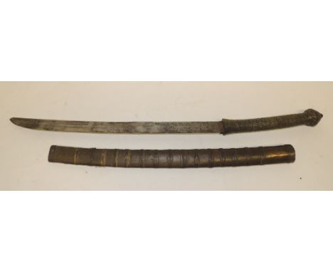 A Burmese Dha with decorative brass grip, the slightly curved single edge blade with cross hatch detail to the back and in me