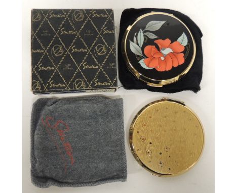 A Stratton powder compact the cover with red floral design, in box and felt pouch together with another Stratton powder compa