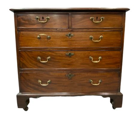 GEORGE III MAHOGANY CHEST, in the manner of Thomas Chippendale having two short over three long lined drawers with brass swan