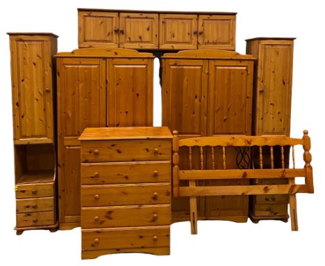 MODERN PINE BEDROOM FURNITURE comprising a pair of two door wardrobes, 187cms H, 100cms W, 53cms D and an overbed cupboard en