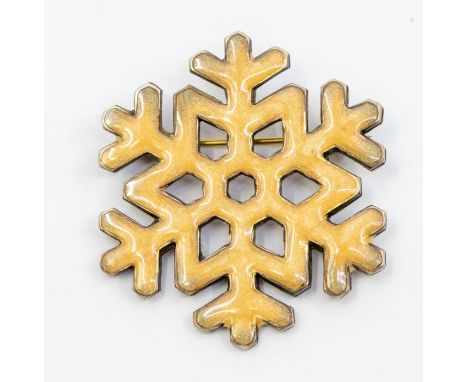Astri Holthe- a  Norwegian silver gilt and enamel brooch in the form of a snowflake, gold tone enamel, size approx 30mm, mark