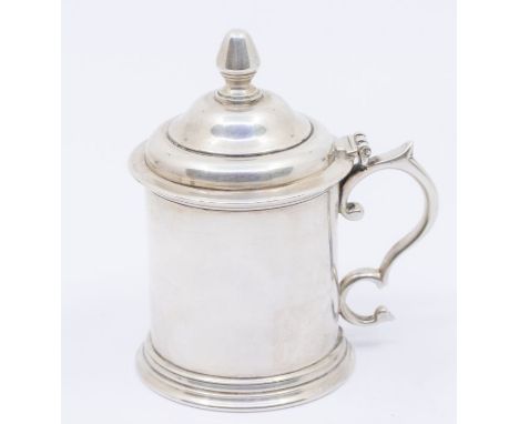 A Modern Irish silver plain mustard pot and cover, the domed cover with bud finial, S scroll handle, hallmarked by Royal Iris