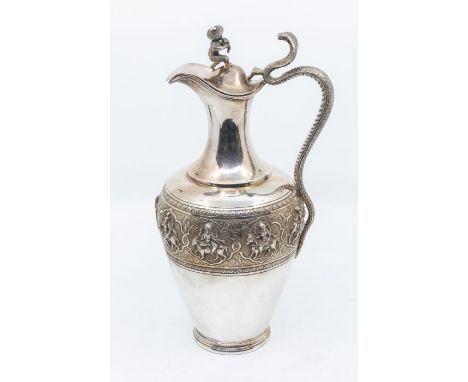 A 19th Century Anglo-Indian "Swami-Ware" Madras silver claret jug, plain baluster body chased with a central band procession 