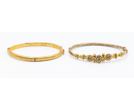 Two Victorian yellow metal bangles including a gold plated ruby, pearl and sapphire set bangle (plate is worn)along with a 9c