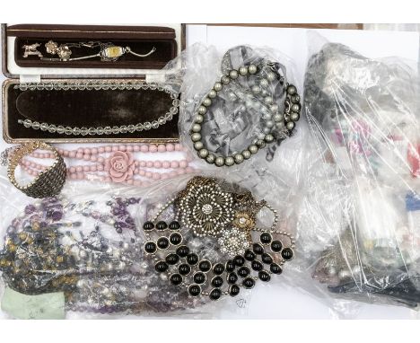 A collection of costume jewellery to include vintage and later bead necklaces, bangles, brooches, chains,&nbsp; compacts, wat