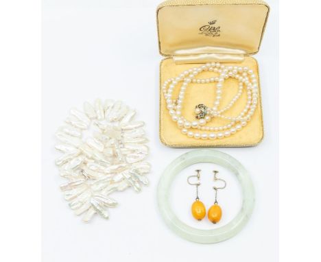 A pair of butterscotch amber oval drop earrings on screw fittings, total gross weight approx 4.7gms along with a keshi pearl 