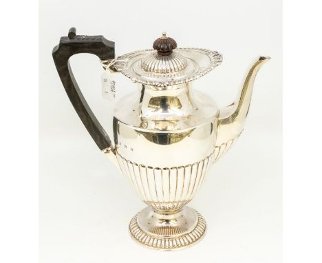 A Georgian style large urn shaped coffee pot, gadroon and rocaille border, plain body and lower fluted section, ebonised hand