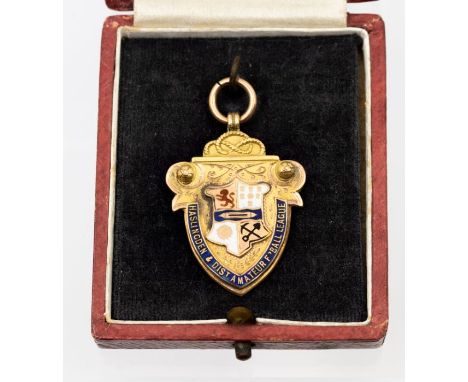 Football: A 9ct gold and enamel football medal, 'Haslingden &amp; District Amateur Football League', hallmarked 'Vaughton &am