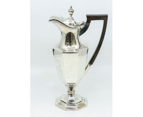 An Edwardian silver octagonal claret jug and cover, with fruitwood handle, domed cover with urn shaped finial, hallmarked by 