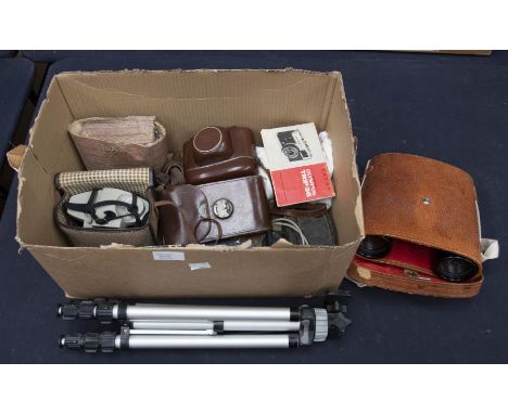 Vintage collection of cameras and binoculars, with a tripod and other accessories