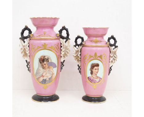 A Victorian two piece Staffordshire garniture to include a pair of large graduating two handled vases, pink ground each decor