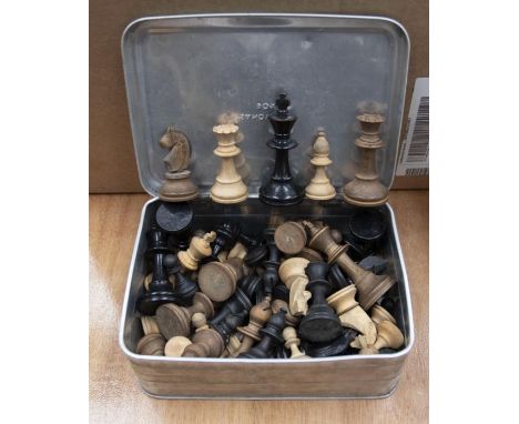 Mid 20th Century two wooden chess sets in a vintage tin