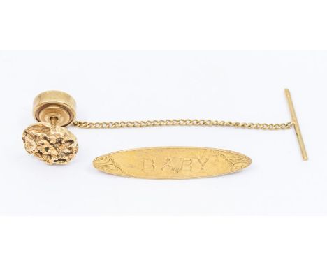 A 9ct gold brooch, lozenge shaped engraved with 'baby' replacement base pin, along with a 9ct gold tie pin with reticulated d