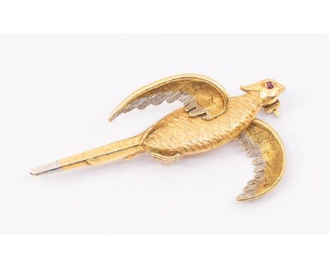 An 18ct gold pheasant brooch with engraved feather decoration and ruby set eye, white gold tipped wings, length approx 45mm, 