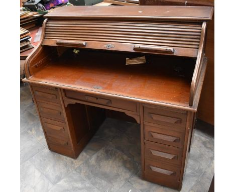 A group of furniture comprising a mid 20th Century roll top desk, a display cabinet, two chairs, a modern musical sewing box 