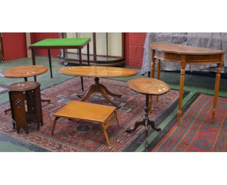 A North African hexagonal occasional table; a yew veneered oval occasional table; another, circular top; a modern serpentine 