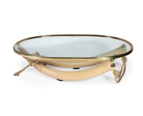 VALENTÍ.Table model Elefante, 70s.Resin, brass and glass.Measurements: 42 x 160 x 100 cm.The history of the Valentí firm goes