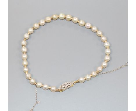 A natural pearl and yellow metal spacer set bracelet with diamond set clasp, with Gem &amp; Pearl Laboratory report dated 15/