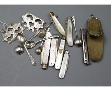 Six assorted mother of pearl mounted silver fruit knives, six spoon(four silver) a sterling pencil holder and white metal buc