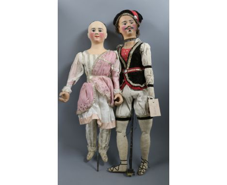 A pair of rare automaton dolls, circa 1840 in original costume from the family of Johann Baptist Taeschler, a well known Swis