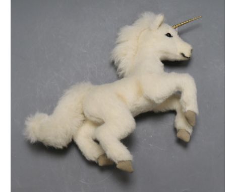 A Steiff unicorn, white tag and box with horn guard