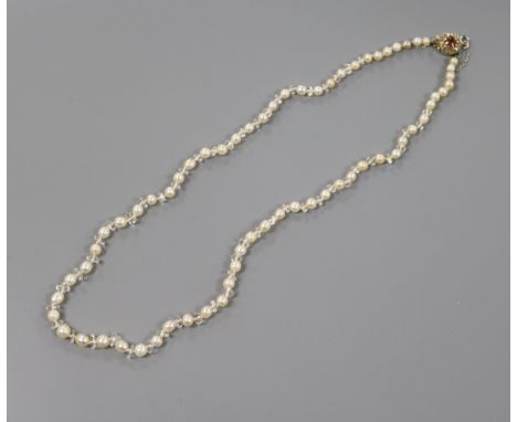 A single strand cultured pearl necklace with paste spacers and early 20th century yellow metal, hessonite garnet and diamond 