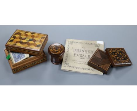A Tunbridge Ware cylindrical nutmeg grater, a Tangram puzzle box with booklet and a small playing card box