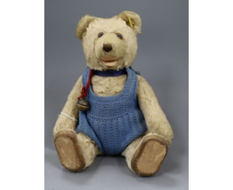 A small 1920s Steiff blonde mohair teddy bear with squeeze box, with glass eyes brown stitched nose and paws, Steiff button i