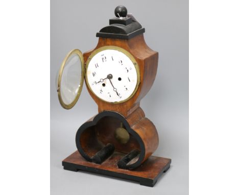 A Biedermeier birch mantel clock 40cm high
