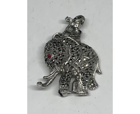A SILVER MARCASITE ELEPHANT BROOCH WITH A RUBY EYE 