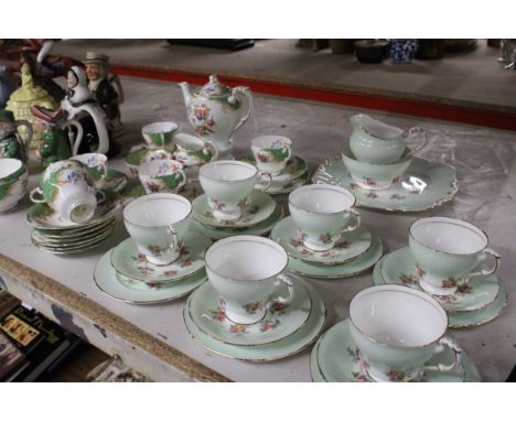 A PARAGON DOUBLE WARRANTED ROCKINGHAM TEA SET TO INCLUDE COFFEE POTS, SUGAR AND CREAMER, COFFEE CUPS, TEA CUPS TOGETHER WITH 