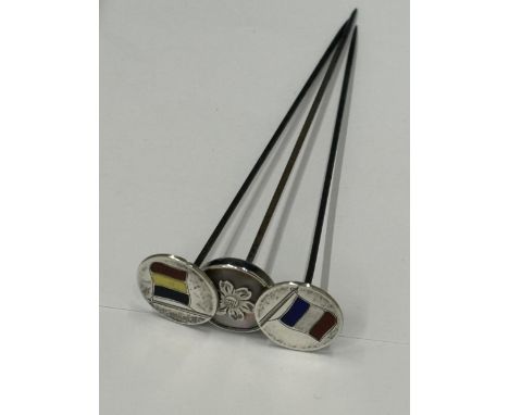 THREE HALLMARKED BIRMINGHAM SILVER HATPINS ONE WITH MOTHER OF PEARL AND FLOWER DESIGN TOP AND TWO WITH FLAGS OF ALLIES BELGIU