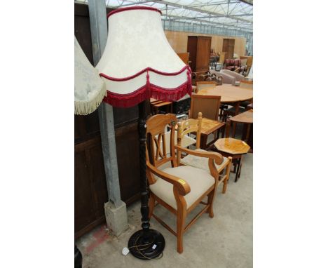 A STANDARD LAMP WITH BARLEY-TWIST COLUMN AND SHADE 