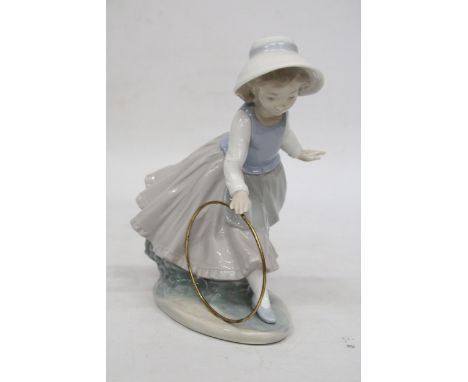 A NAO FIGURE OF A GIRL WITH A HOOP 