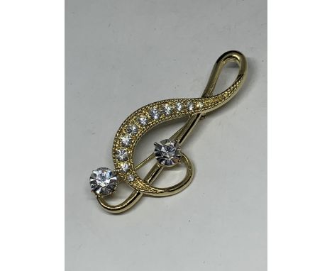 A VINTAGE CLEAR STONE TREBLE CLEF PIN BROOCH 