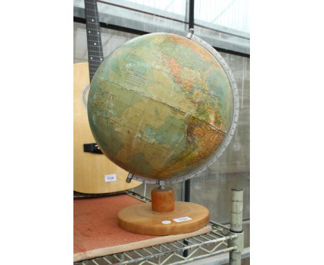 A VINTAGE REVOLVING WORLD GLOBE WITH WOODEN BASE 