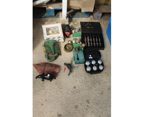 AN ASSORTMENT OF VINTAGE ITEMS TO INCLUDE TWO CAST MONEY BOXES, A BOULES SET AND BOOK ENDS ETC Notice from the the-saleroom.c