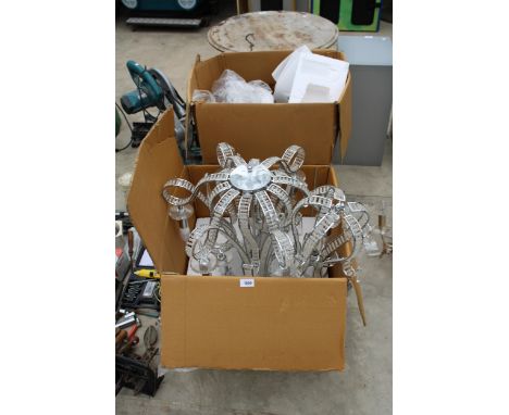 A PAIR OF DECORATIVE METAL LIGHT FITTINGS AND A SMALLER MATCHING LIGHT FITTING