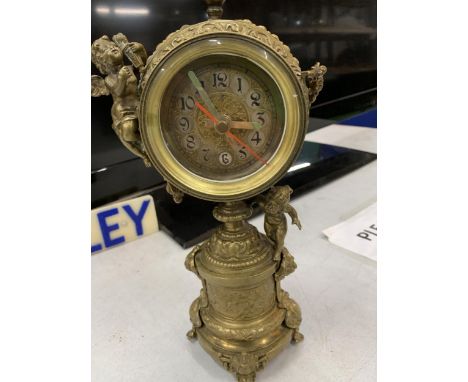 A VINTAGE BRASS CHERUB MANTLE CLOCK, HEIGHT 29CM 