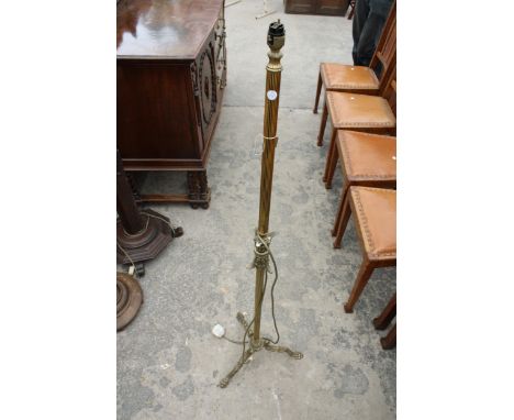 A BRASS STANDARD LAMP ON TRIPOD BASE 
