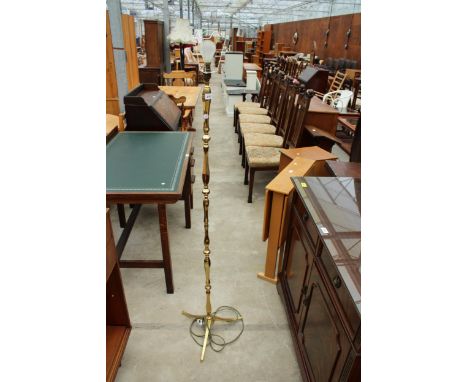 A BRASS STANDARD LAMP ON TRIPOD BASE 
