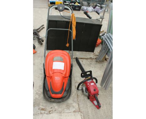 AN XXX TOOLS PETROL CHAINSAW AND AN ELECTRIC FLYMO LAWN MOWER 