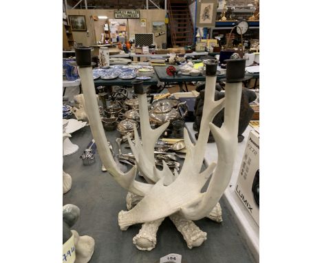 A UNUSUAL CANDLESTICK HOLDER IN THE DESIGN OF ANTLERS 